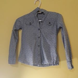 Baby blue polo with black flowers.